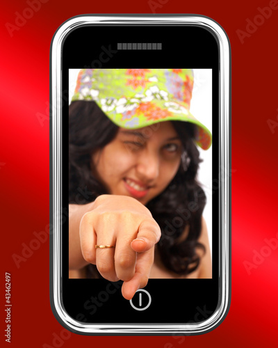 Photo: Young Asian Girl Pointing Out Of Mobile Young Asian Girl Pointing Out Of Mobile