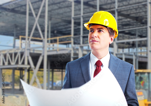 Photo: Engineer constructor with a project. Engineer constructor with a project.