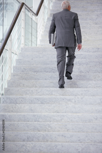 Photo: Businessman going upstairs Businessman going upstairs