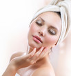 Spa Girl. Beautiful Young Woman After Bath Touching Her Face