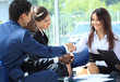 Happy smiling businesswoman shaking hands after