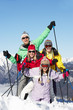 Teenage Family On Ski Holiday In Mountains