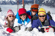 Family Having Fun On Ski Holiday In Mountains