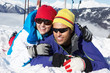 Couple Having Fun On Ski Holiday In Mountains