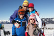 Family On Ski Holiday In Mountains