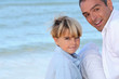 father and his son near the sea