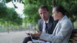 Business couple arguing in the park, tracking shot