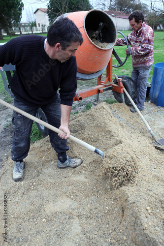Photo: Men mixing cement Men mixing cement