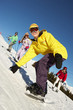 Teenage Family On Ski Holiday In Mountains