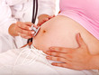 Pregnant woman with doctor .