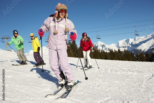 Photo: Teenage Family On Ski Holiday In Mountains Teenage Family On Ski Holiday In Mountains