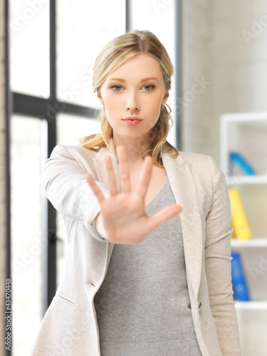 Photo: young woman making stop gesture young woman making stop gesture