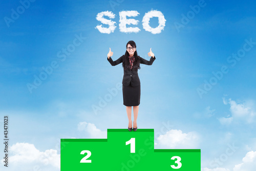 Photo: Happy businesswoman with her First rank website Happy businesswoman with her First rank website