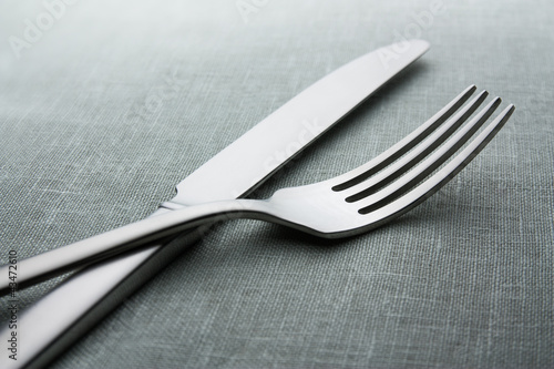 Photo: knife and fork on a neutral background knife and fork on a neutral background