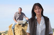 happy couple relaxing in their farm