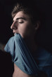 Man biting shirt