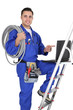 young craftsman pointing at his laptop