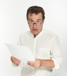 Scared man reading a document