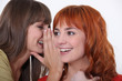 young women gossiping