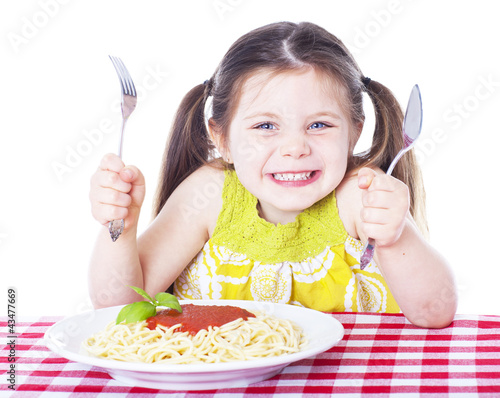 Photo: Beautiful girl eating pasta Beautiful girl eating pasta