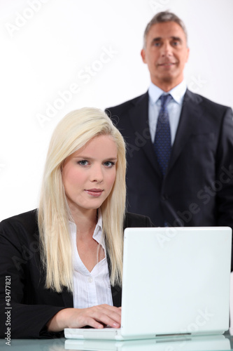 Photo: Man approaching from behind young blonde Man approaching from behind young blonde