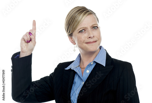 Photo: Expressive businesswoman with pointing finger Expressive businesswoman with pointing finger