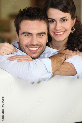 Photo: Couple relaxing on sofa Couple relaxing on sofa
