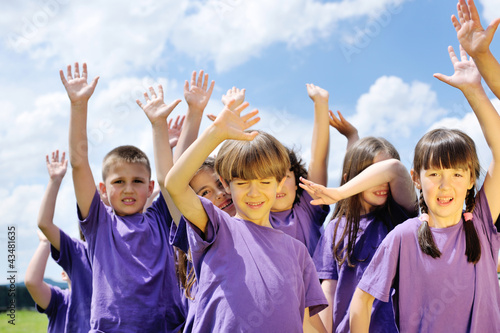 Photo: happy kids group have fun in nature happy kids group have fun in nature
