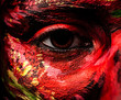 Close-up portrait of an artistic woman painted face