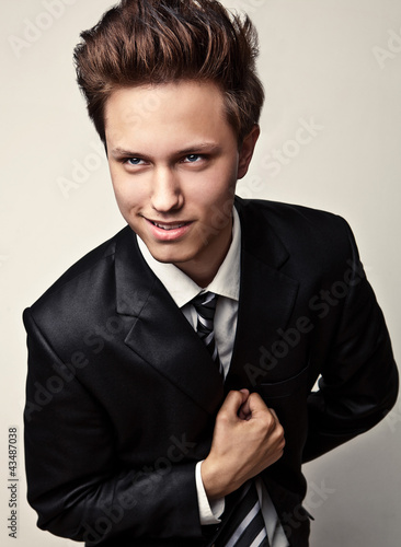 Photo: Handsome young man studio portrait. Handsome young man studio portrait.