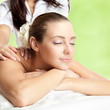 Foto: Beautiful woman at massage procedure Beautiful woman at massage procedure