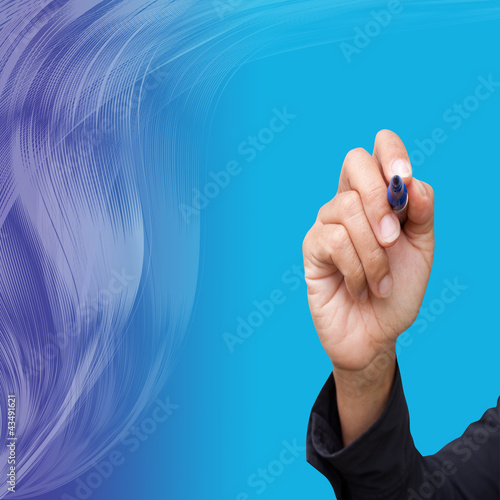 Photo: Business hand writing on abstract lines background Business hand writing on abstract lines background
