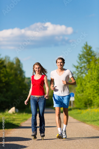 Photo: Young couple doing sports outdoors Young couple doing sports outdoors