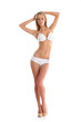 A young Caucasian woman posing in a white swimsuit