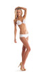 A young Caucasian woman posing in a white swimsuit