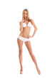 A young Caucasian woman posing in a white swimsuit