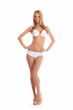 A young Caucasian woman posing in a white swimsuit