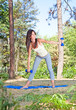 Young beautiful woman doing  exercises in the park
