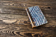 Photo: Aged book on wooden table Aged book on wooden table