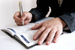 business woman writing her schedule