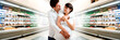 Young pregnant couple at supermarket