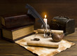 Photo: old papers and books on a wooden table old papers and books on a wooden table