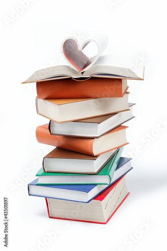 Foto: A stack of books on a white background. A stack of books on a white background.