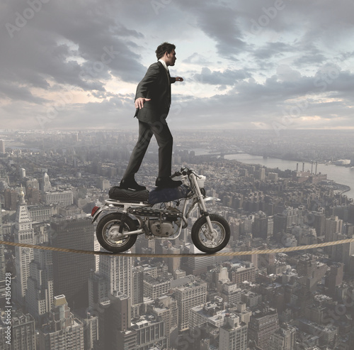 Photo: Businessman and acrobatic challenges Businessman and acrobatic challenges