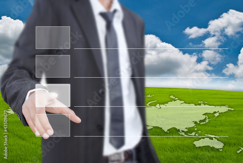 Photo: Businessman pushing Button on blue sky. Businessman pushing Button on blue sky.