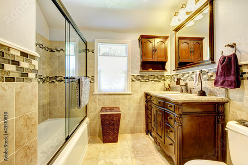 Photo: Nice bathroom with natural stone tiles and wood cabinet. Nice bathroom with natural stone tiles and wood cabinet.