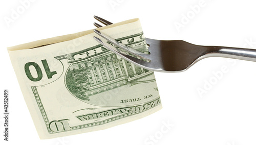 Foto: Banknotes on a fork on white background close-up Banknotes on a fork on white background close-up