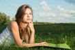 Young female relaxing in the grass