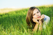 Young female relaxing in the grass