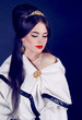 Luxury beautiful woman in white tippet, poncho
